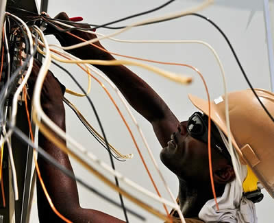 Electrician Working on Electrical Wiring